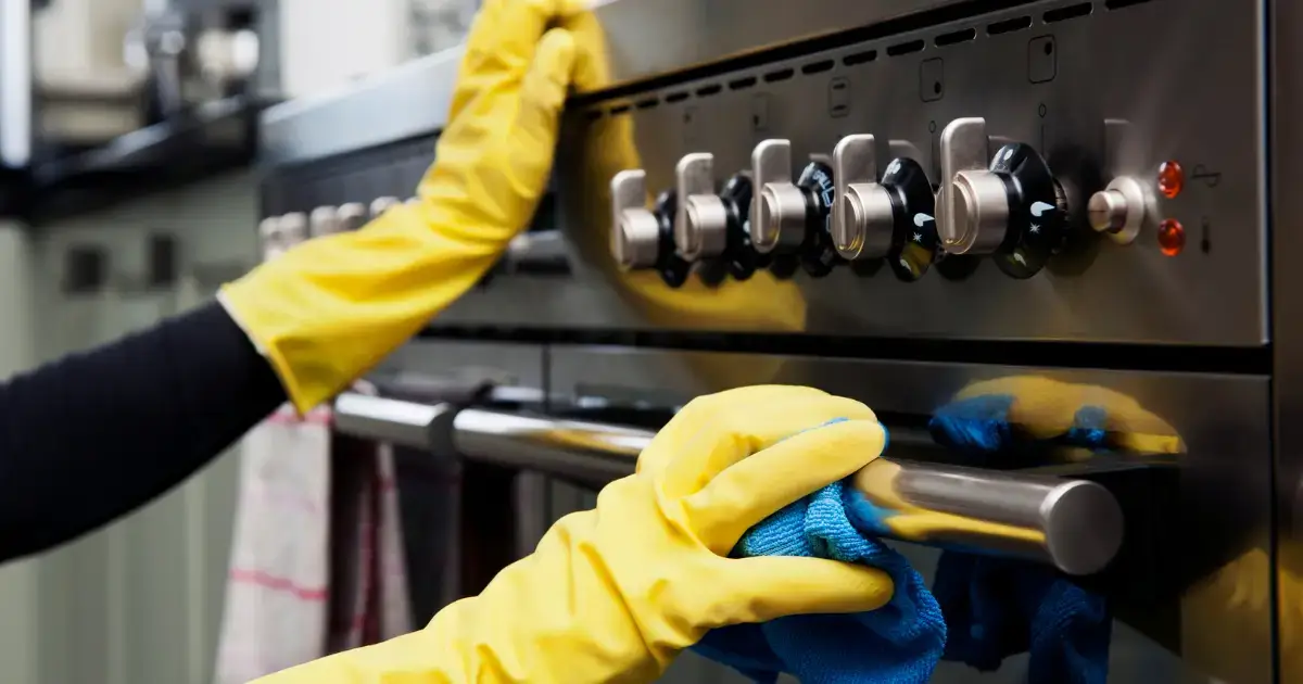 Maid to Shine experts cleaning a oven during a deep cleaning service